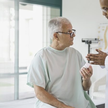 Doctor explaining prescription to senior patient